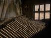 Patterns from sunlight wash a sand mound in a Kolmanskop house Slide #00000-00000